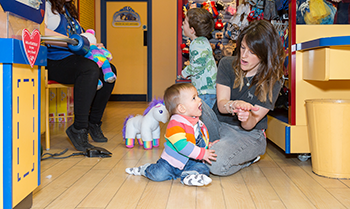 Mother using Makaton to communicate with a child who has cleft lip